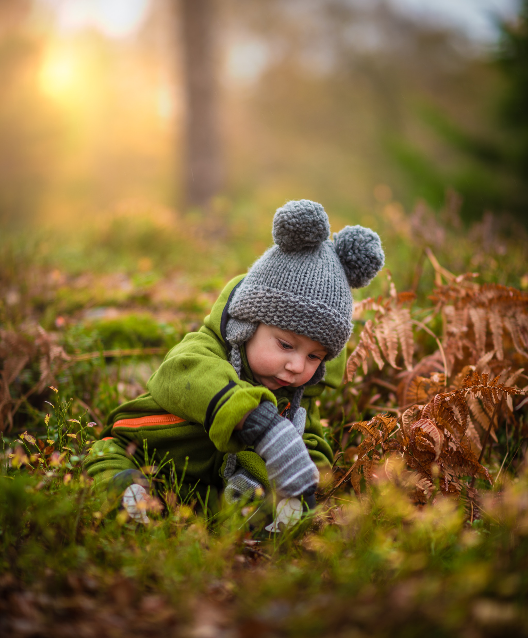 Child playing in leaves in winter time child-play-in-leaves-winter-nz-ece
