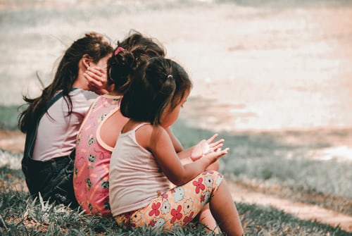 Lasting connections are built from nurturing relationships three-young-girls-sitting-on-grass