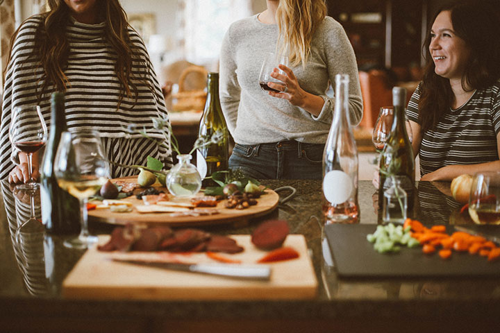 A wine with friends and colleagues can go a long way. nz-ece-teachers-around-table-relaxing